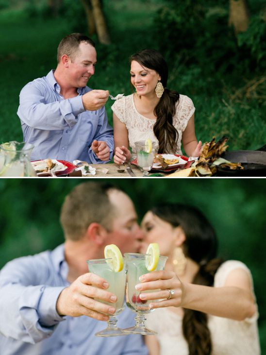 Couple enjoying a romantic meal and drinks at outdoor picnic