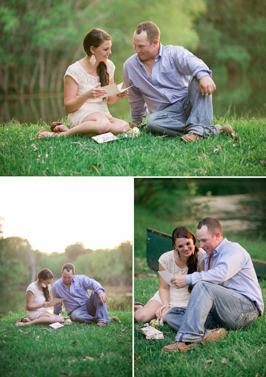 Couple sharing a special moment reading cards in a park