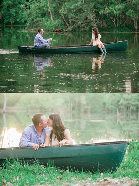 Couple in canoe share a romantic moment and a kiss on the lake