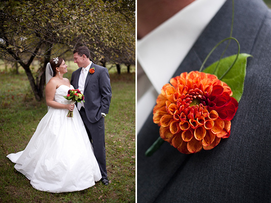 Elegant bride and groom pose at outdoor wedding with flower details