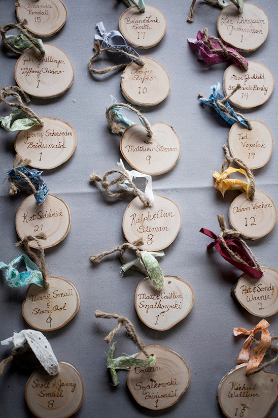 Wooden wedding place cards with rustic, elegant design and names