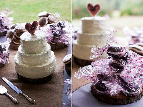 Rustic wedding cake with a heart topper and packaged treats