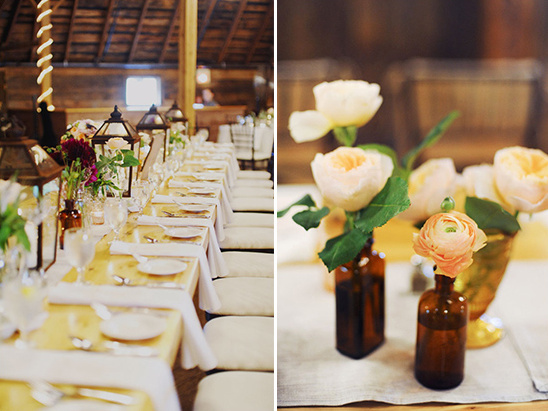 Rustic wedding table with floral centerpieces and lanterns