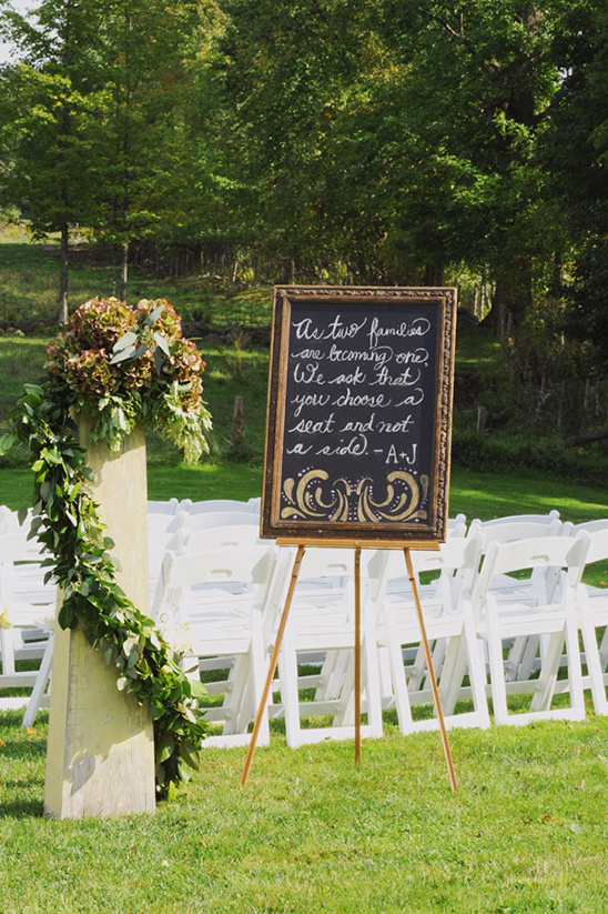 Wedding sign with quote asking to choose a seat, not a side