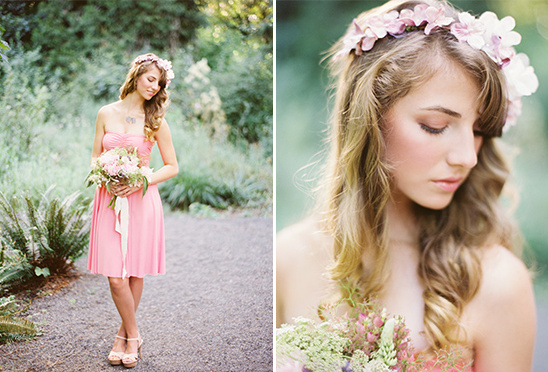 Bridesmaid in pink dress with flower crown and bouquet in the garden