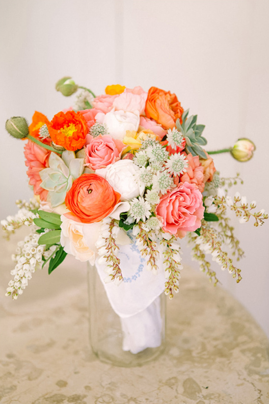 orange and coral wedding bouquet by Spiral Hand