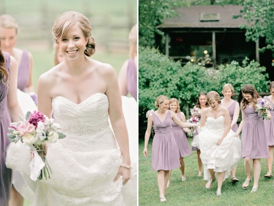 Bride smiling with her bridesmaids in lavender dresses