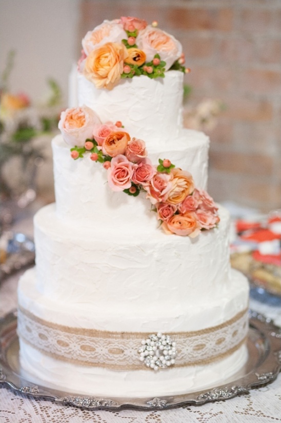 buttercream wedding cake with peach flowers