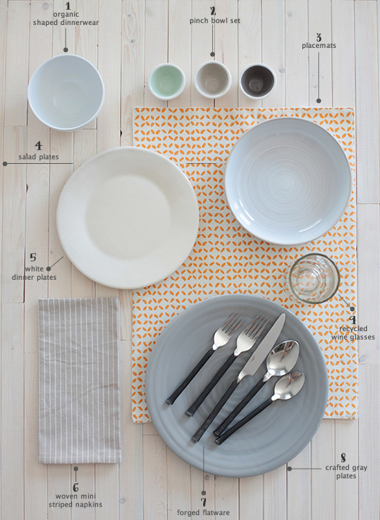 Elegant table setting with plates, cutlery, and minimalist decor