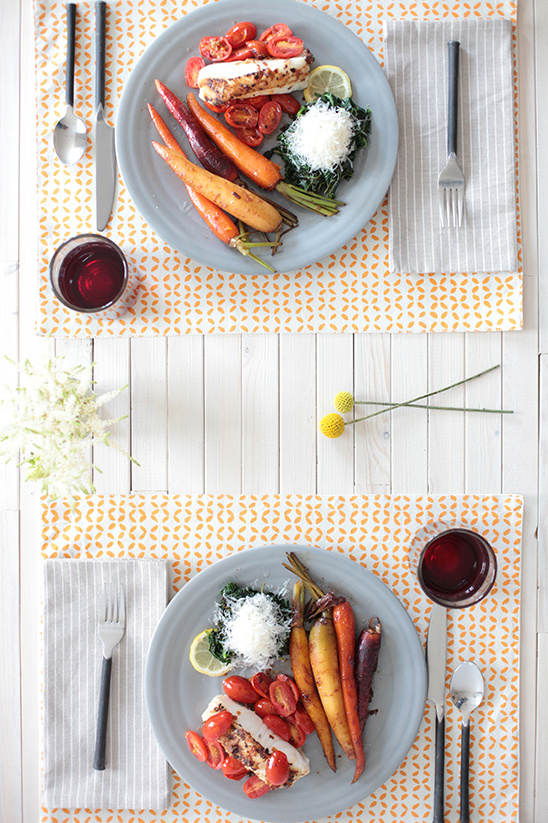 Two plates of healthy food with vegetables and a glass of juice