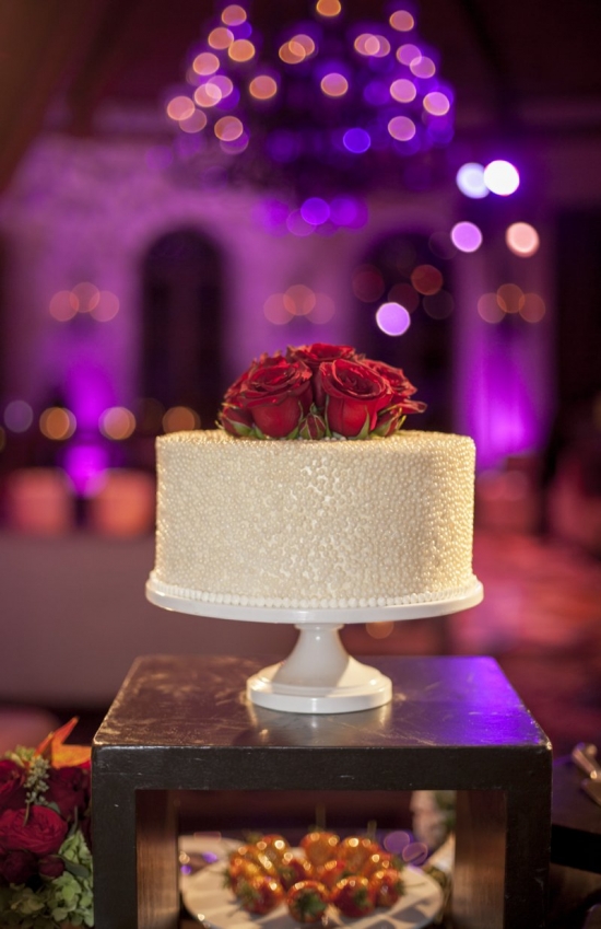 Elegant pearl wedding cake with red roses