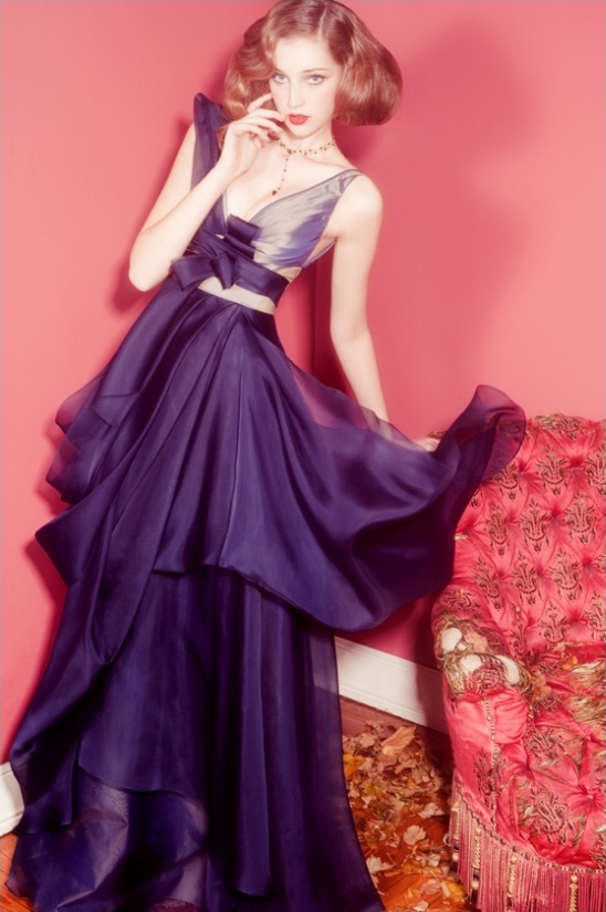 Woman in elegant purple gown fashion portrait