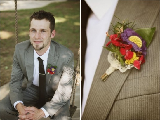 Groom in gray suit with colorful boutonniere