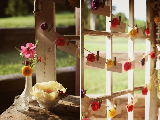 Floral wedding place card display on window