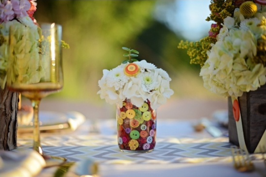 Button adorned mason jar with flowers centerpiece decor