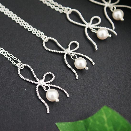 Bow charms with swarovski pearls necklaces from www earringsnation com