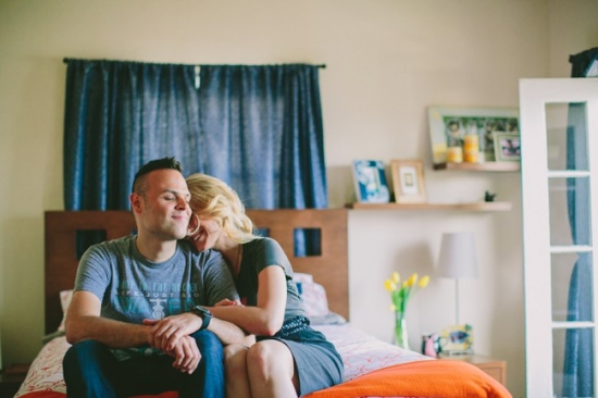 Couple cuddling on bed