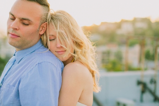Couple embracing outdoors sunny day