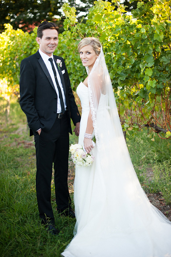 Bride and groom on wedding day in vineyard setting