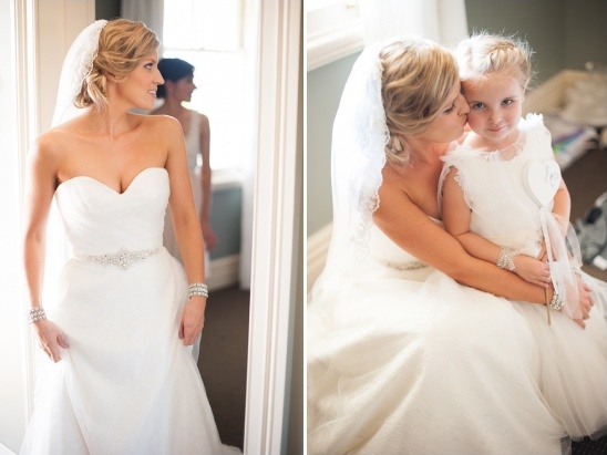 Bride in wedding dress with flower girl