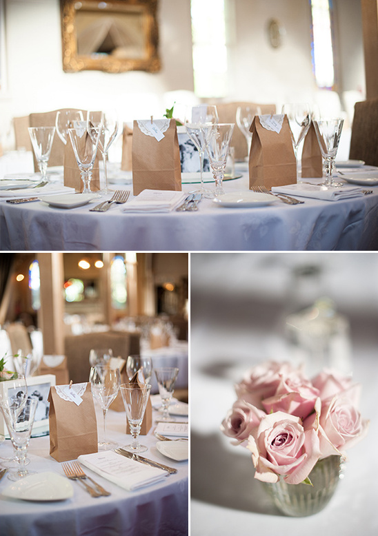 Wedding reception table setting with favors and flowers