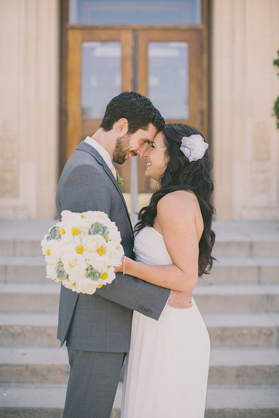 Bride and groom lovingly embrace on their wedding day
