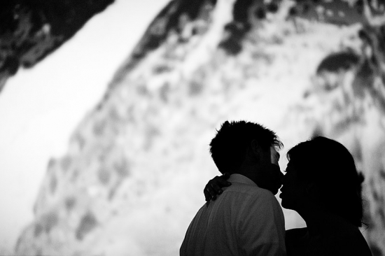 Silhouette of loving couple about to kiss softly