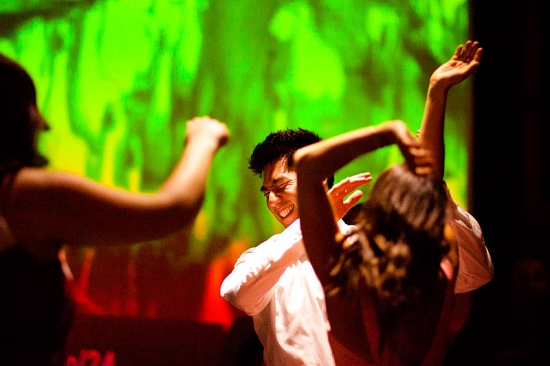 People dancing with enthusiasm at a vibrant party