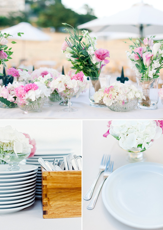 Beach wedding table setting with pink and white flowers