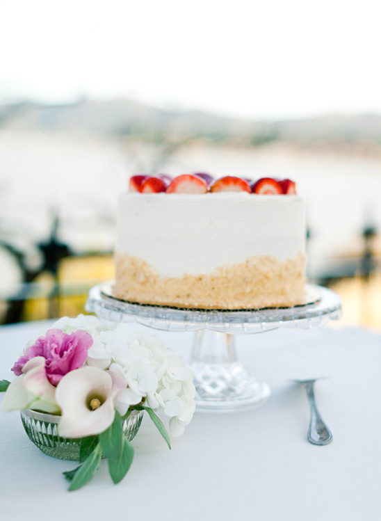Strawberry cake on glass cake stand