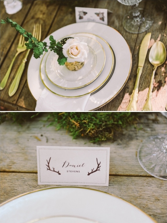 Rustic wedding place setting with gold trim and flower