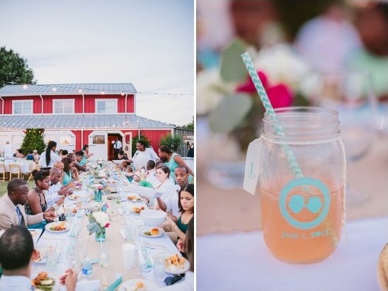 Rustic barn wedding reception with guests enjoying a meal