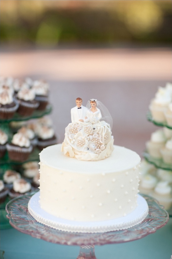 Classic wedding cake with bride and groom topper image