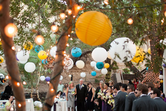Outdoor wedding reception with paper lanterns lights