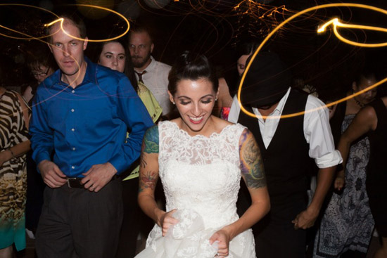 Bride dancing at her wedding reception with guests