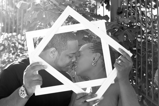 Black and white engagement photo with square frame