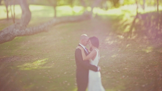 Couple embraces outdoors wedding scene