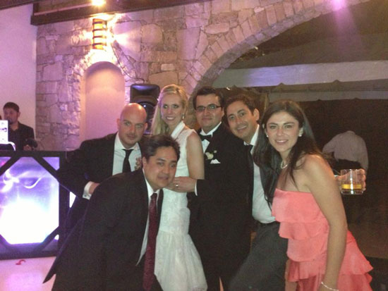 Wedding guests celebrating with the bride and groom