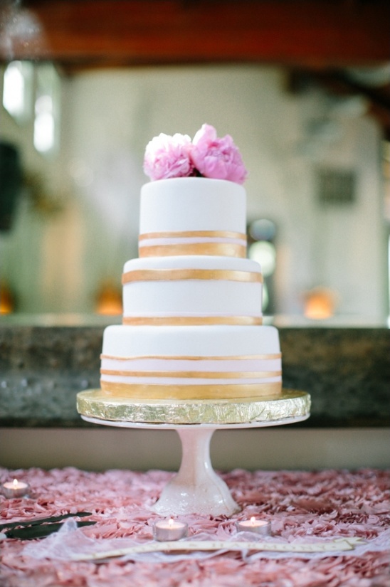 gold, white and pink wedding cake by Village Bakery