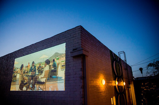 outdoor movie projector at wedding reception