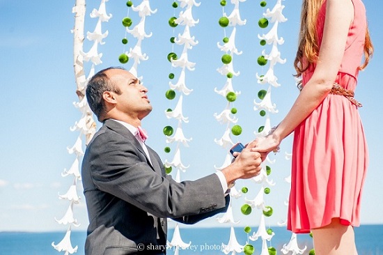 Man proposing with ring, beach proposal