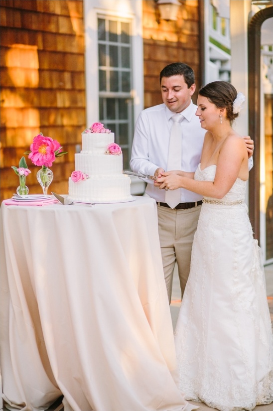 pink and white wedding cake by Cassieâs Custom Cakes