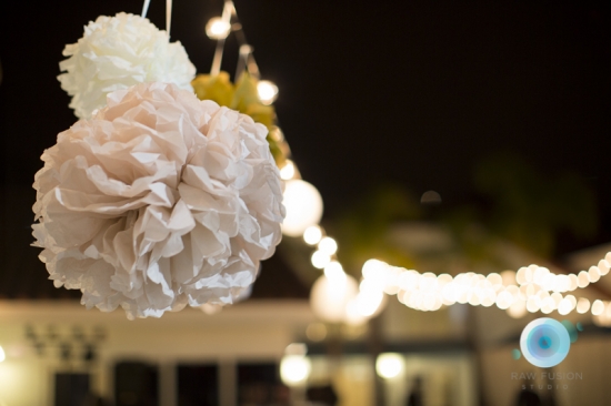 Elegant paper pom-poms illuminate evening event