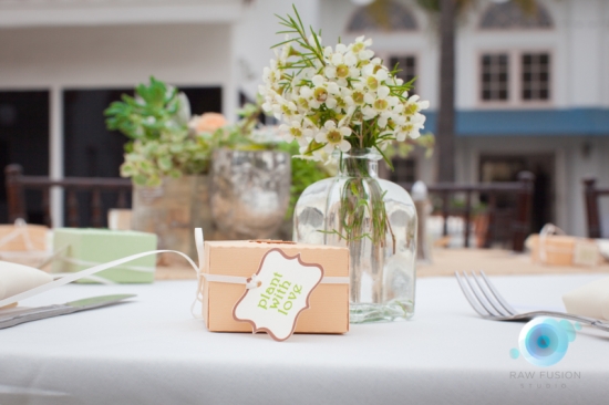 Wedding table setting with flower vase and favor box