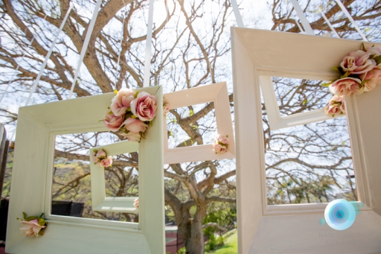 Hanging frames with flowers outdoors for wedding decor