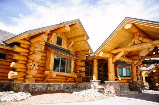 Beautiful log cabin home with stone foundation