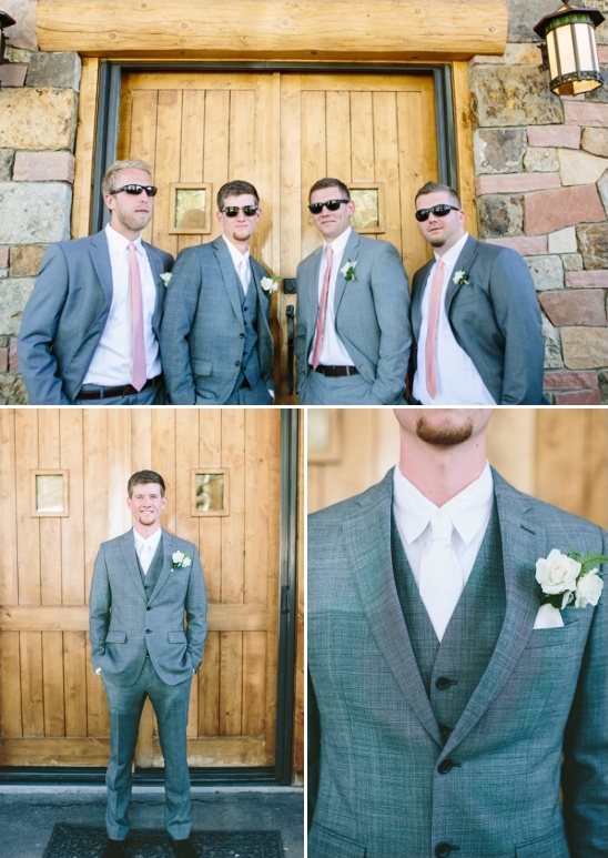 Groomsmen in gray suits pose for wedding photo