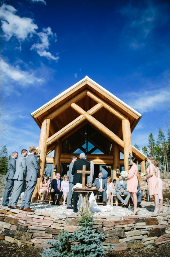 Outdoor wedding ceremony at log cabin