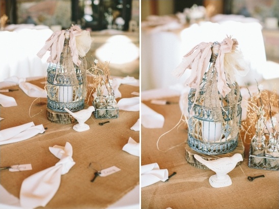 Rustic wedding centerpiece: birdcage with shabby chic decor