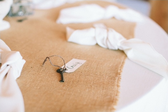 Rustic wedding table setting with key and name tag